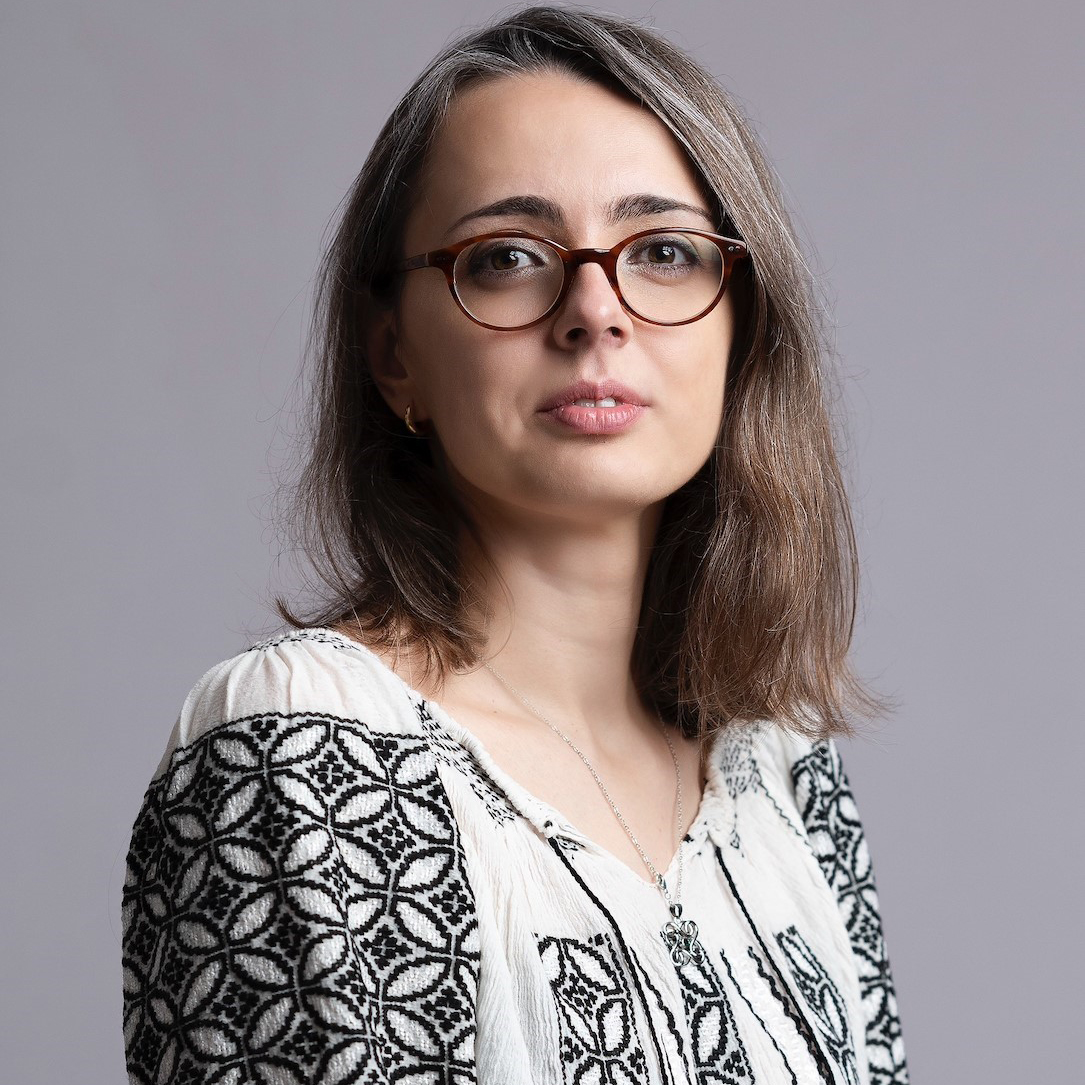 An image of a woman looking at the camera